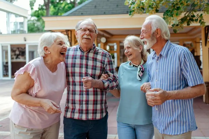 Group of senior friends enjoying time at their senior care facility in Shreveport, LA