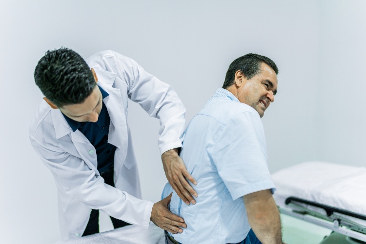man with lower back pain receiving advanced pain management services at a nursing home in Shreveport, LA